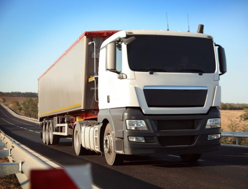 Beautiful view of asphalt highway with truck. Road trip